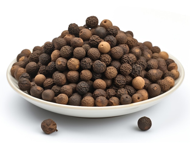 A bowl of black seeds with a white background