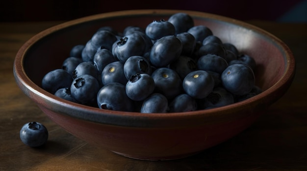 A bowl of blueberries sits on a table.