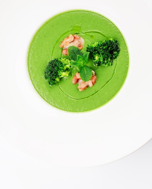 Bowl of broccoli cream soup with walnut