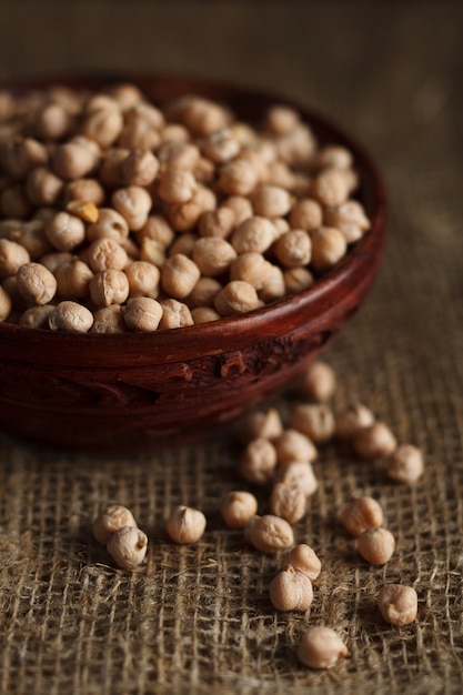 Bowl of chick-pea on sackcloth.