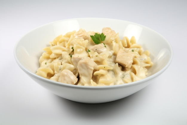 A bowl of chicken and pasta with parsley on top