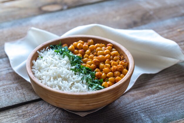 Bowl of chickpea curry with white rice and fresh cilantro