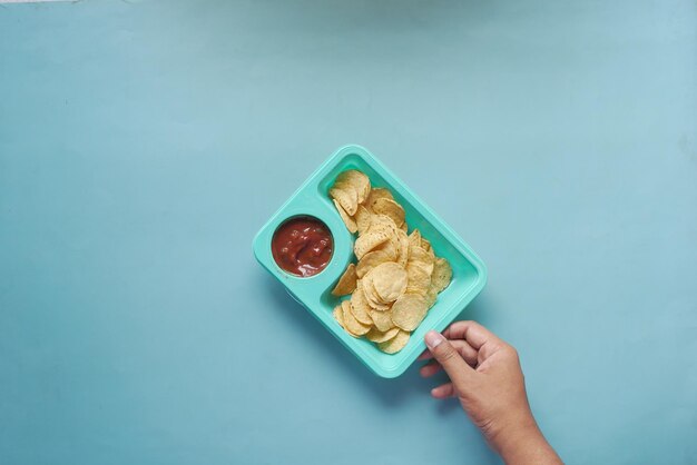 A bowl of chips and salsa on table