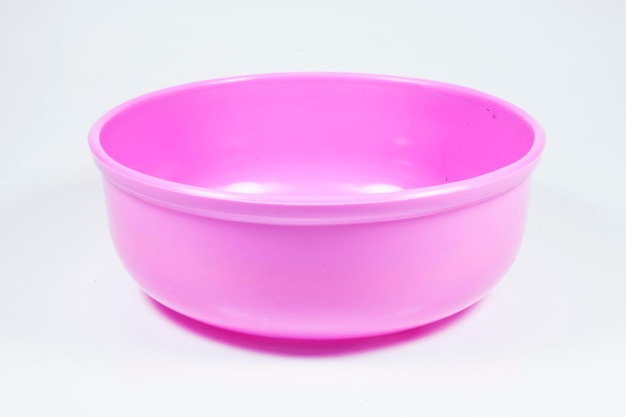 A bowl of colorful water on a white background