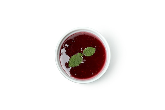 Bowl of cranberry sauce isolated on white background