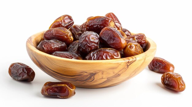 a bowl of dates with a wooden bowl of dates on it