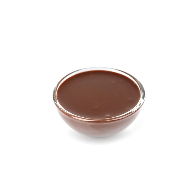 bowl of delicious chocolate sauce isolated on white