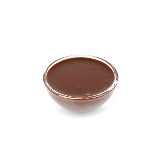 Bowl of delicious chocolate sauce isolated on white