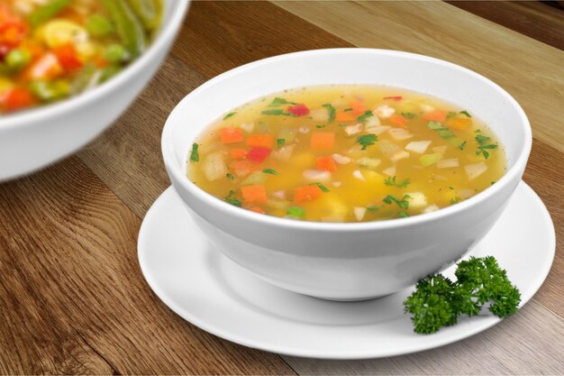 Bowl of delicious vegetables soup on  table