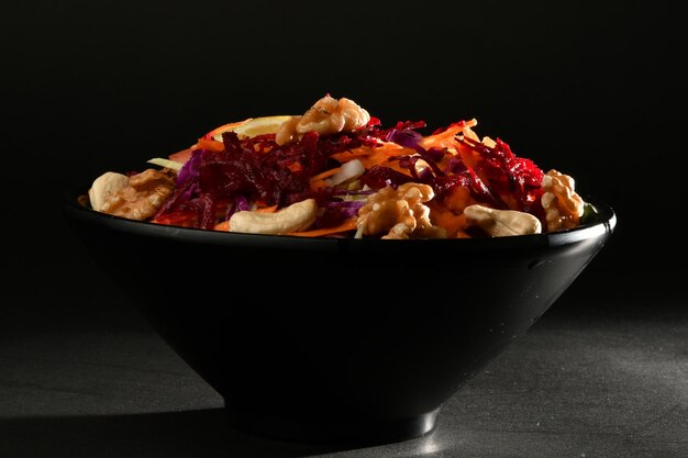 A bowl of food with a black background