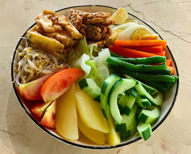 A bowl of food with a black rim and a black rim