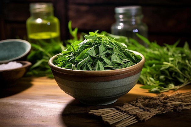 a bowl of fresh basil is on a wooden table.