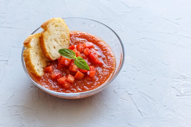 A bowl of fresh gazpacho. Cold tomato soup.
