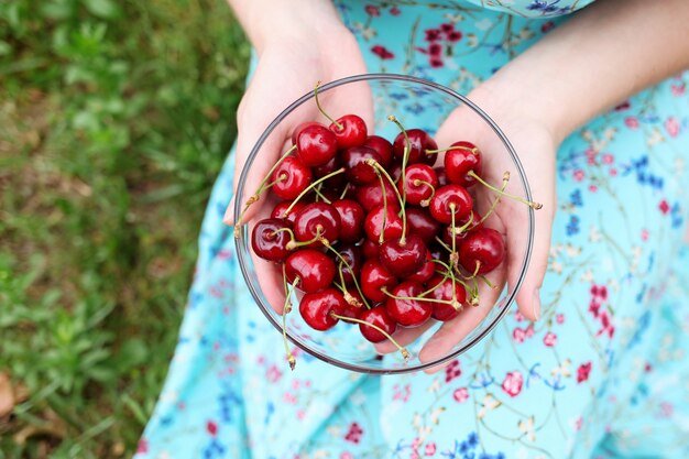 Photo bowl of fresh organic cherry as healthy snack, for breakfast, dieting, vegan.