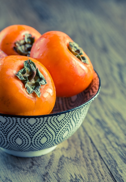 Bowl of fresh persimmons