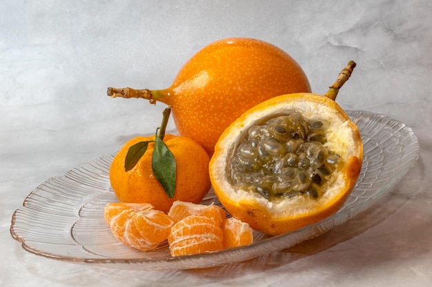 A bowl of fruit mandarin, passion fruit