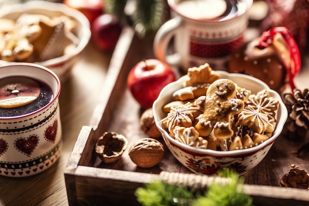 A bowl full of Christmas gingerbread along with hot punch