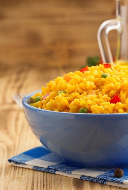 Bowl full of rice on wooden