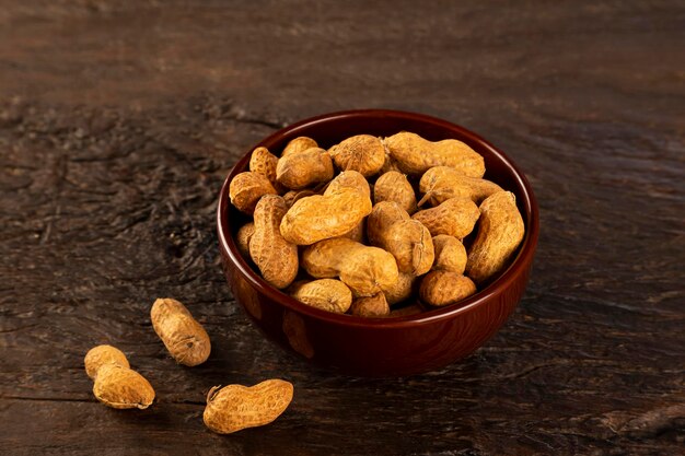 Bowl full of roasted peanuts.