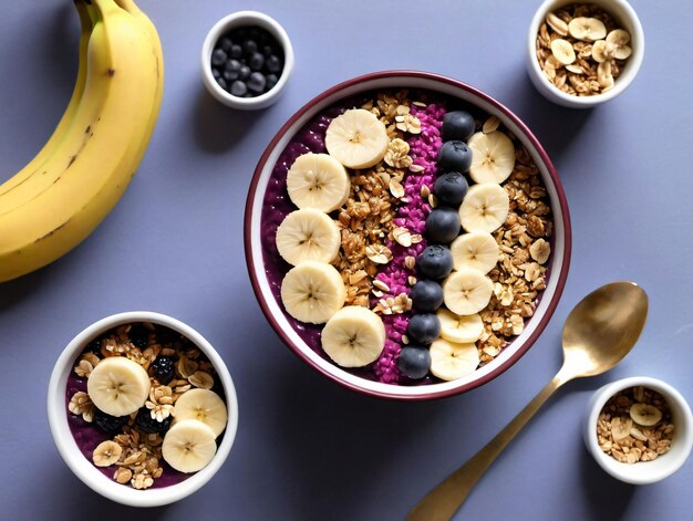 A Bowl Of Granola Topped With Bananas And Blueberries