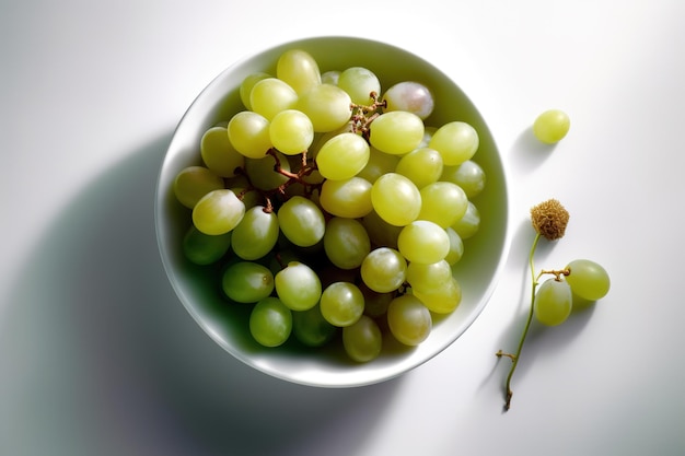 A bowl of grapes next to a single stem.