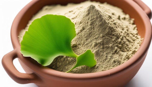 A bowl of green leaves and brown powder