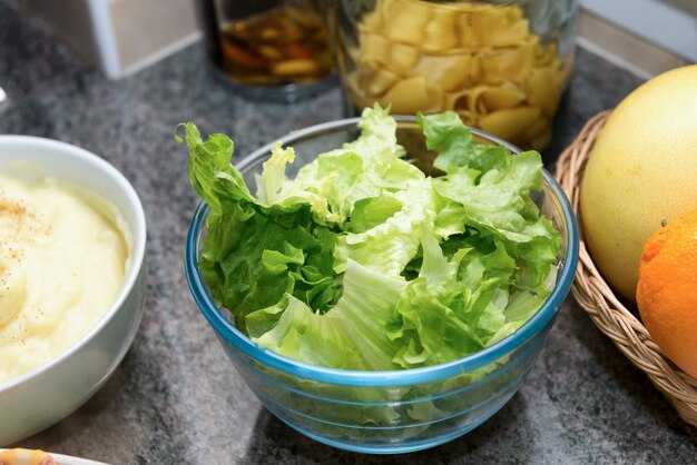 Bowl of green salad in the kitchen