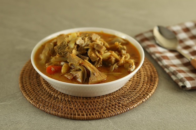 A bowl of gulai nangka or jackfruit curry stew.