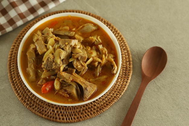 A bowl of gulai nangka or jackfruit curry stew.