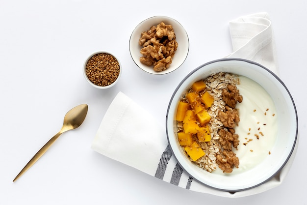 Bowl of homemade granola with yogurt and cereals