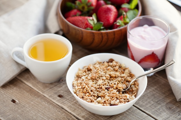 A bowl of homemade granola with yogurt.