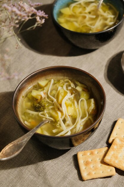 Bowl of homemade vegetable soup with noodles Healthy dinner