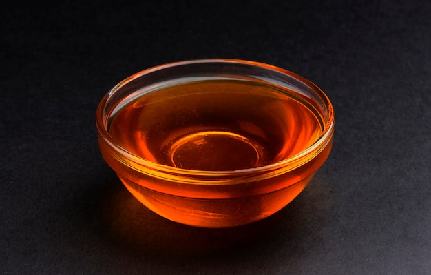 Bowl of honey on black 