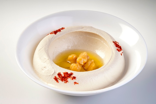 Bowl of hummus isolated