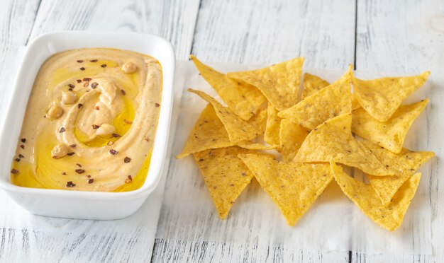 Bowl of hummus on the wooden table