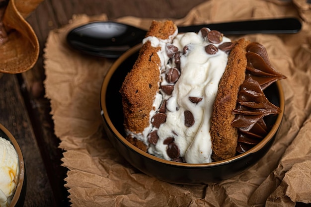 A bowl of ice cream with a spoon on top of it.