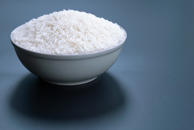 Bowl of jasmine white rice on black backgrounds