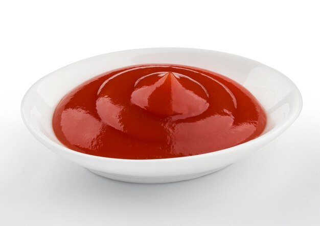 Photo bowl of ketchup isolated on white background with clipping path