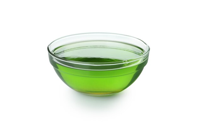 Bowl of kiwi jelly isolated on white background