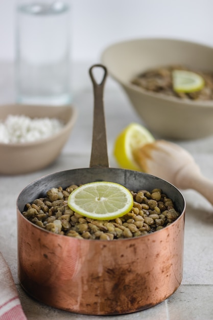 A bowl of lentils with a bowl of rice