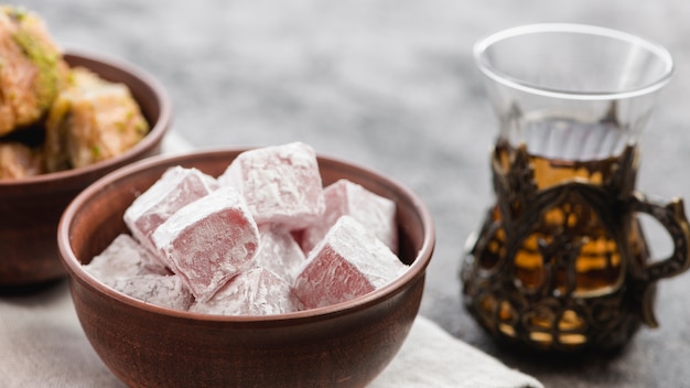 Bowl of lukum sweets and herbal tea for ramadan