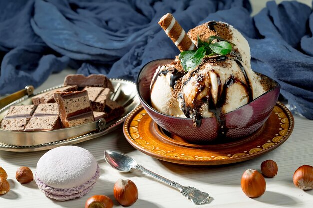 A bowl of macaroons and chocolate on a table