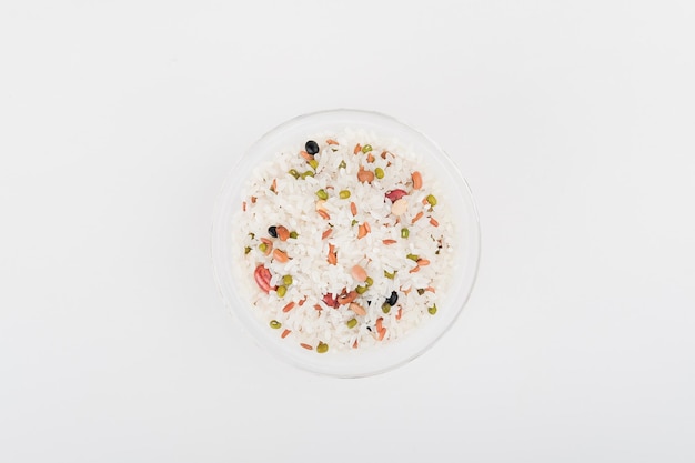 Photo a bowl of mixed rice on top of white background top view