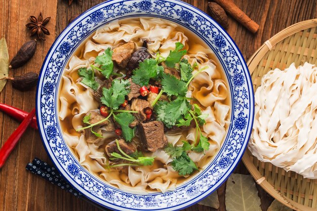 A bowl of noodles with braised beef