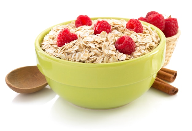 Bowl of oat flake isolated on white