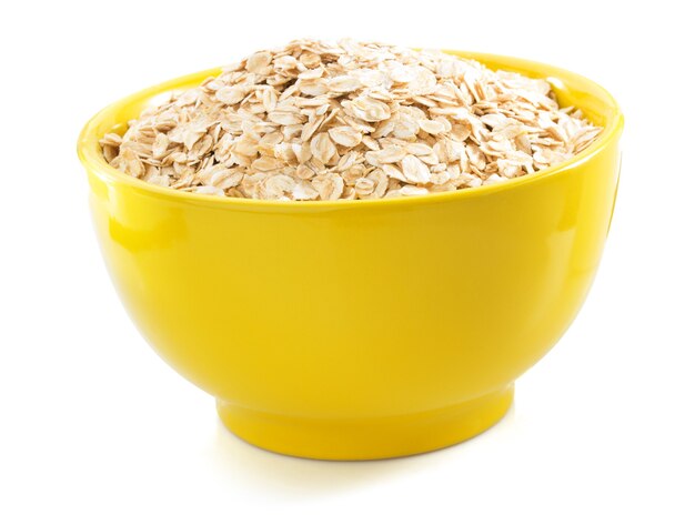 Bowl of oat flake isolated on white