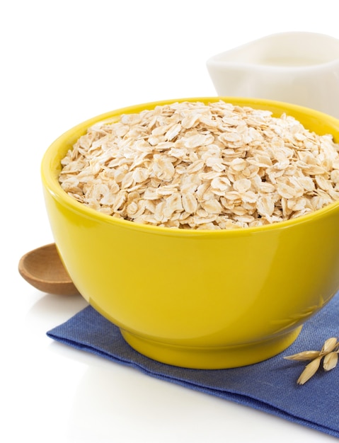 Bowl of oat flake isolated on white