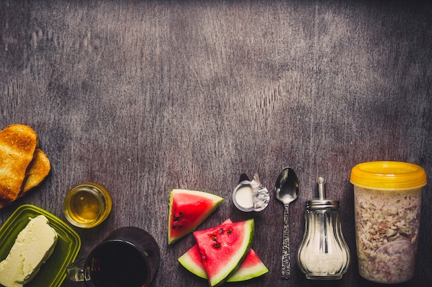 Bowl of oat granola, fresh fruit and honey Top view