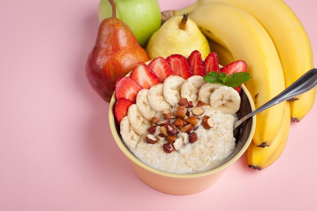 Bowl of oatmeal with a banana.