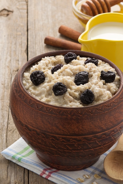 Bowl of oatmeal on wood surface